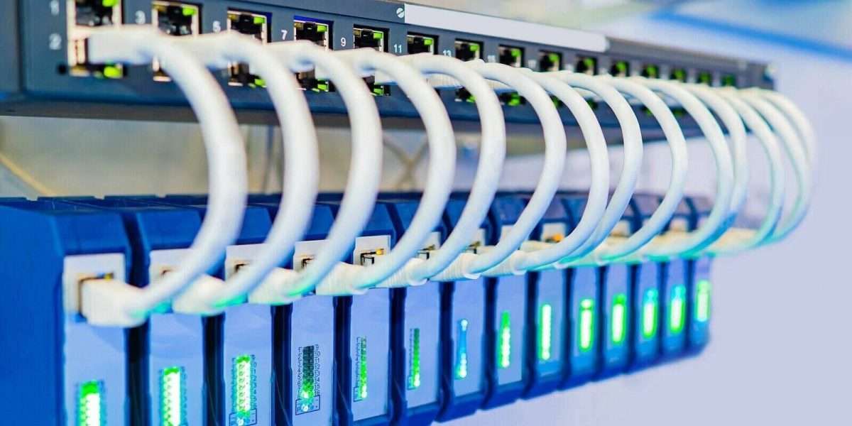 Technician's hand testing a patch panel on network equipment